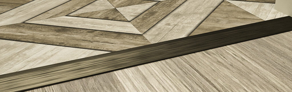 Bronze ramp flooring profile between two wood flooring coverings of varying heights.
