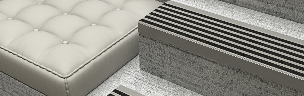 Aluminium Stair Nosing with Black Olympic Grip Infill on a grey staircase, designed to offer grip.