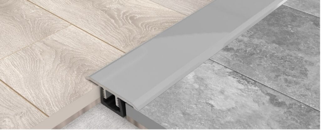 Kliks Floor Trims installed between hard floor coverings.