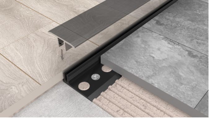 Example of Klik Slim Floor Trim being installed within hard floor coverings. 