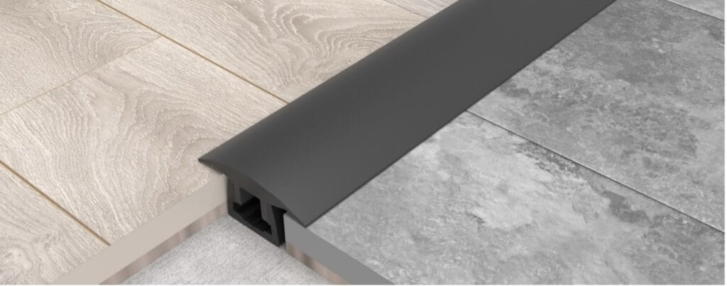Kliks Spectrum Zip installed between two hard floor coverings.