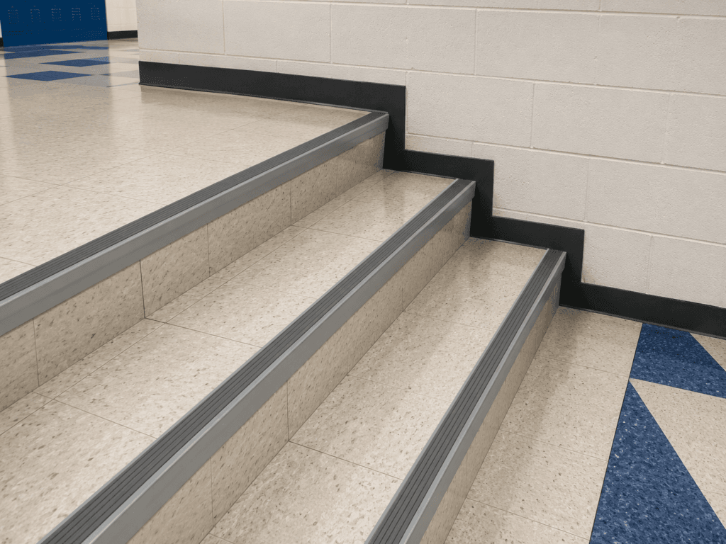 AN15/55 Satin Stair Nosings with a PVC Castellated Infill in Flint at a UK School Installation